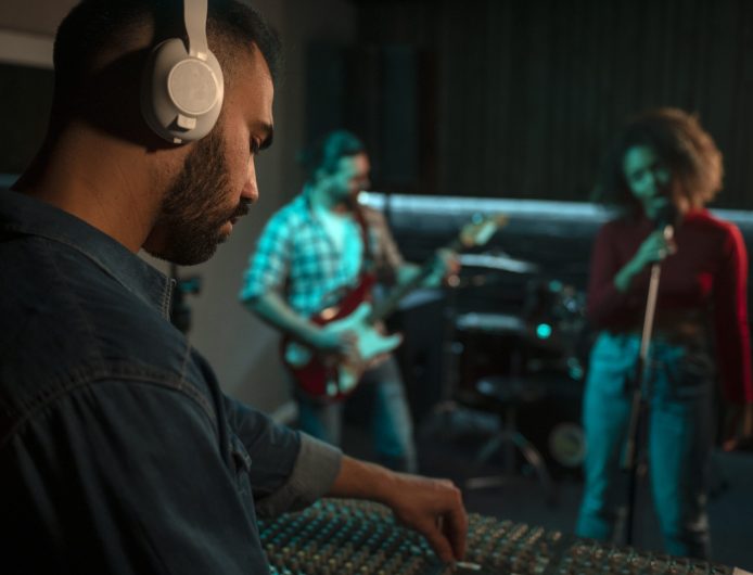 side-view-musicians-working-studio